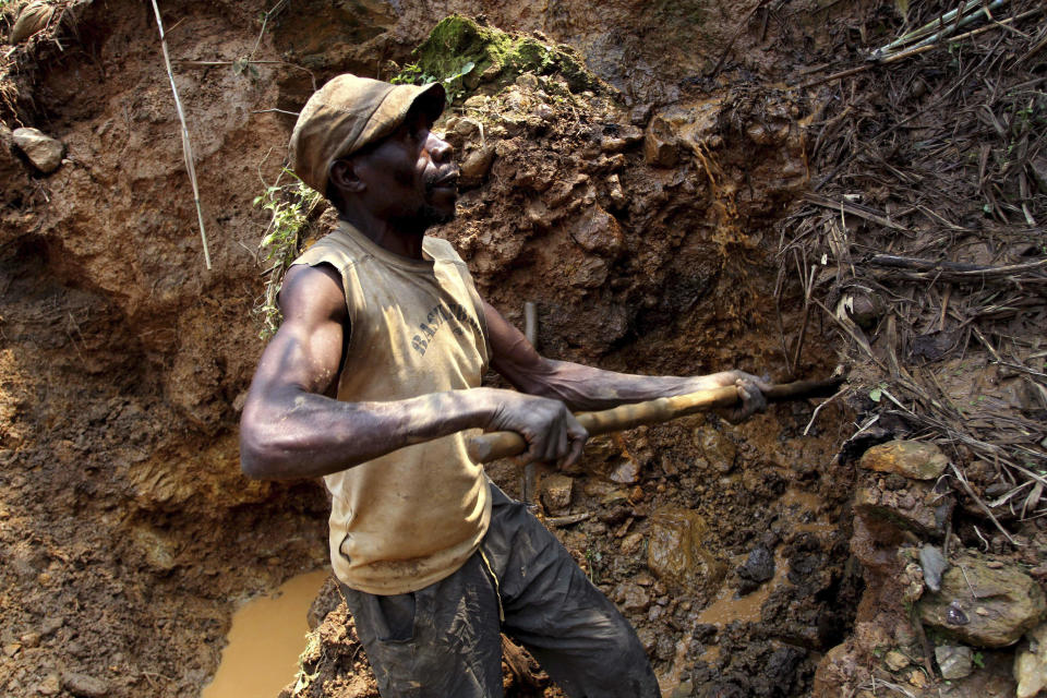 An Aug. 17, 2012 file photo shows a Congolese man digging for cassiterite, the primary ore of tin, at a mine in the eastern Democratic Republic of Congo. / Credit: Marc Hofer/AP