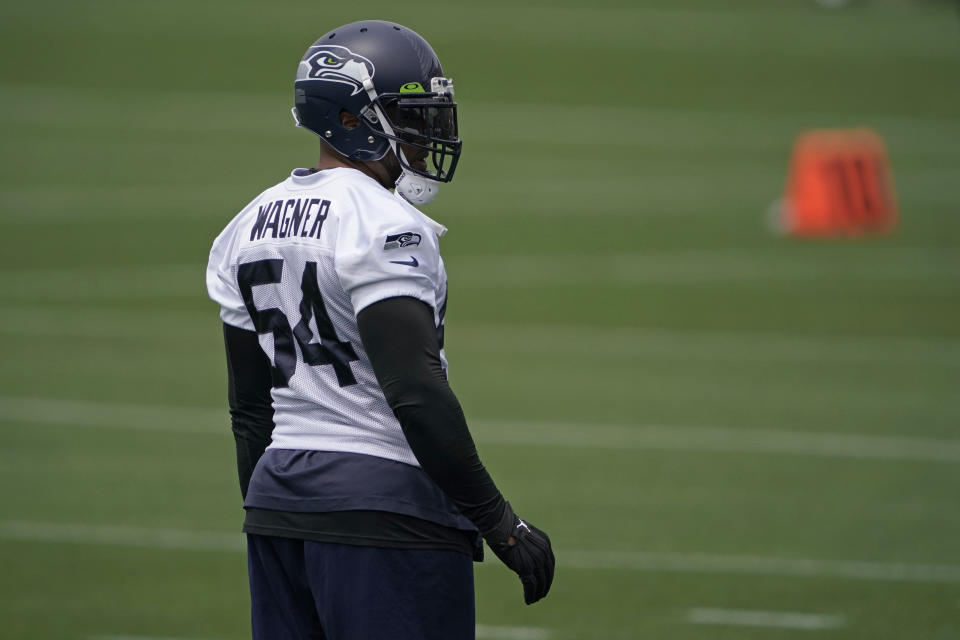 Seattle Seahawks middle linebacker Bobby Wagner stands on the field between drills during NFL football practice Tuesday, June 15, 2021, in Renton, Wash. (AP Photo/Ted S. Warren)