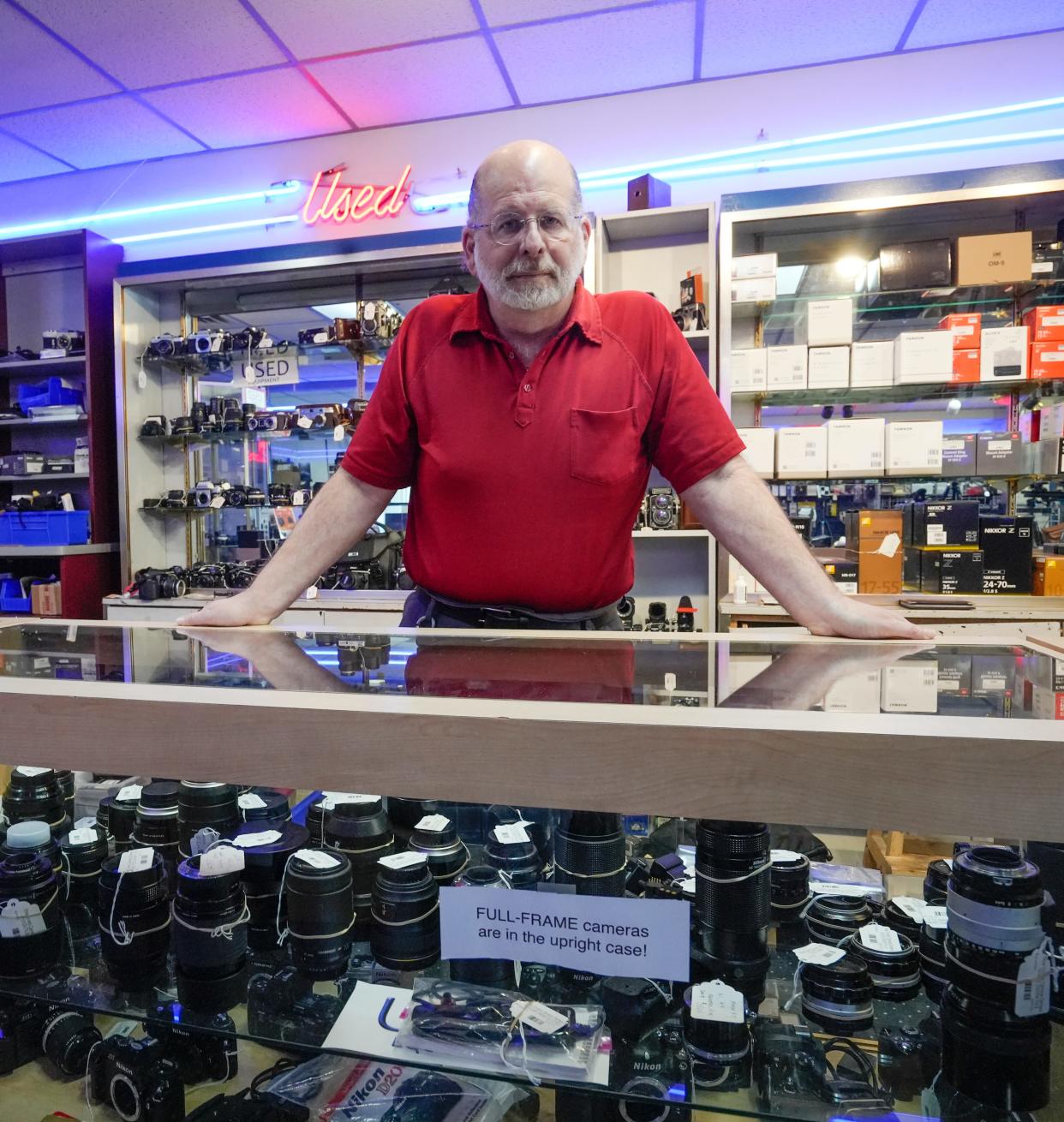 Jeff Dobbs, general manager of Mike Crivello's Cameras in Brookfield, has been working to persuade consumers not to buy photography equipment on the gray market.