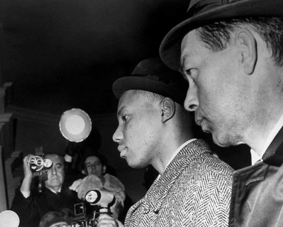 PHOTO: Norman Butler, 26, leaves the police station, following his interrogation in New York, Feb. 27, 1965. He is accused of having participated in the shooting which killed the black nationalist leader Malcolm X. (Archives/AFP via Getty Images, FILE)