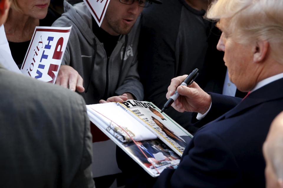 <p>Republican presidential candidate Donald Trump signs a copy of a <em>Playboy</em> magazine with him on the cover for a memorabilia collector after a rally in Walterboro, S.C., Feb.17, 2016. (Photo: Jonathan Ernst/Reuters) </p>