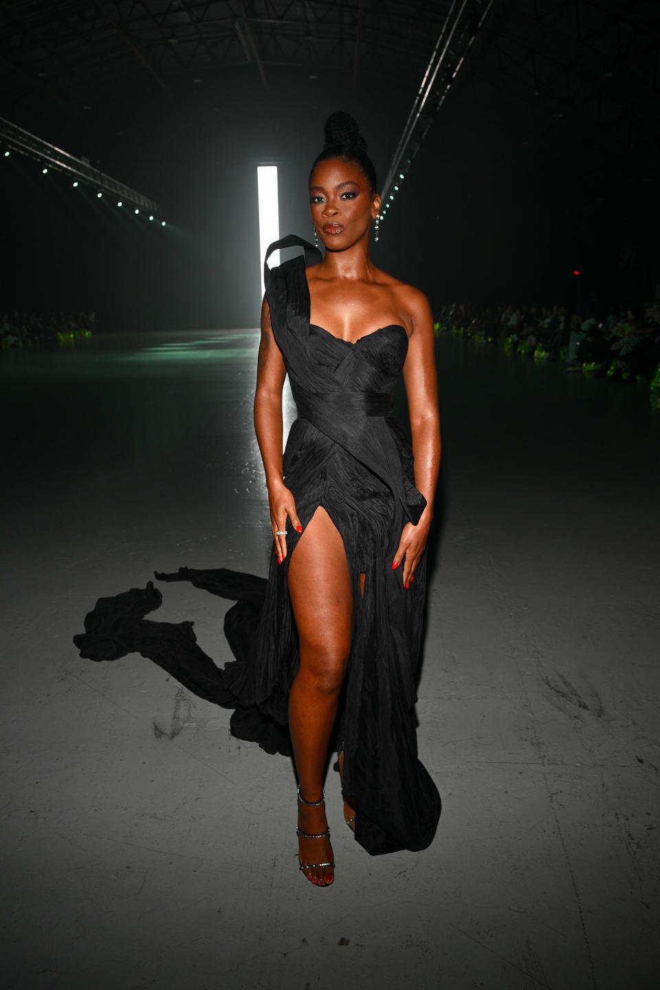 Ari Lennox wearing black dress