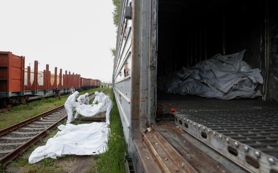 Several hundred unclaimed bodies of Russian soldiers are now piling up in refrigerated train cars outside Kyiv - Valentyn Ogirenko/Reuters