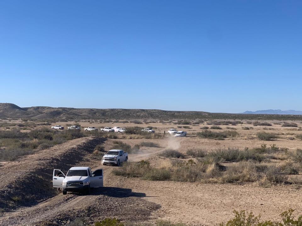 Agents with the Chihuahua State Investigations Agency search the vast desert in the Coyame del Sotol region for a group of missing migrants in December 2022. A mass grave with at least 11 bodies was discovered last week near El Mimbre, Chihuahua.