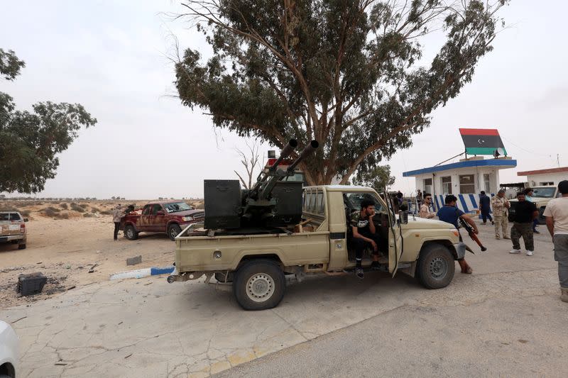 Fighters loyal to Libya's internationally recognised government are seen after taking control of Watiya airbase near Tripoli