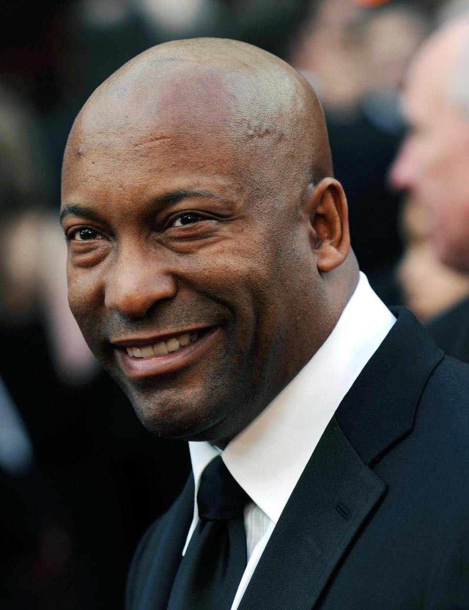 FILE - In this file photo taken Feb. 24, 2008, director John Singleton arrives for the annual Academy Awards in Los Angeles. Singleton and Paramount Pictures on Nov. 1, 2012 settled a lawsuit filed by the director/producer that claimed the studio reneged on a contract to allow his company to produce two additional films after the release of 2005's "Hustle & Flow," which received two Oscar nominations. (AP Photo/Chris Pizzello, File)