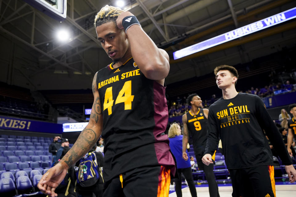 Arizona State guard Adam Miller (44) walks off the court with teammates after their loss to Washington in an NCAA college basketball game Thursday, Jan. 11, 2024, in Seattle. (AP Photo/Lindsey Wasson)