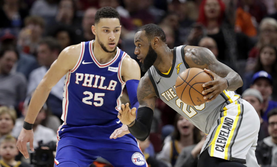 LeBron James and Ben Simmons get acquainted. (AP)