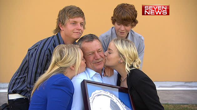 Mark Cummins proudly accepts the title of 'Queensland Father of the Year'.