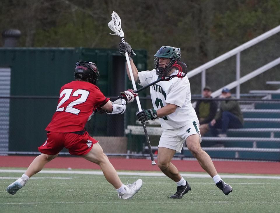 Chris Constantine (13) and Yorktown defeated Rye 9-8 in double overtime in boys lacrosse at Yorktown High School in Yorktown Heights. The senior defender scored the game-winner after Chad Bowen knotted the score with 2.8 seconds to play. Tuesday, April 30, 2024.