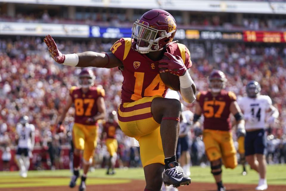 Southern California running back Raleek Brown (14) celebrates after scoring a touchdown during the first half of an NCAA college football game against Rice in Los Angeles, Saturday, Sept. 3, 2022. (AP Photo/Ashley Landis)