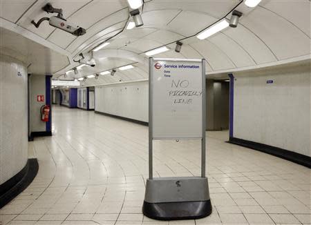 A service information board states "No Piccadilly Line" tube trains during strikes at Kings Cross underground station in London February 6, 2014. REUTERS/Olivia Harris