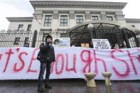 Activists of the "Democratic Alliance" movement stage a performance during a protest rally in front of the Russian embassy in Kiev, February 7, 2014. REUTERS/Konstantin Chernichkin