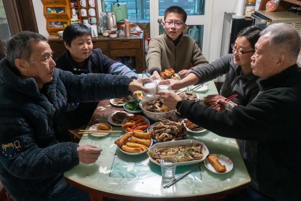 Families members enjoy a New Year's Eve dinner, also known as Reunion Dinner, on January 21, 2023 in Huaibei, Anhui Province of China.