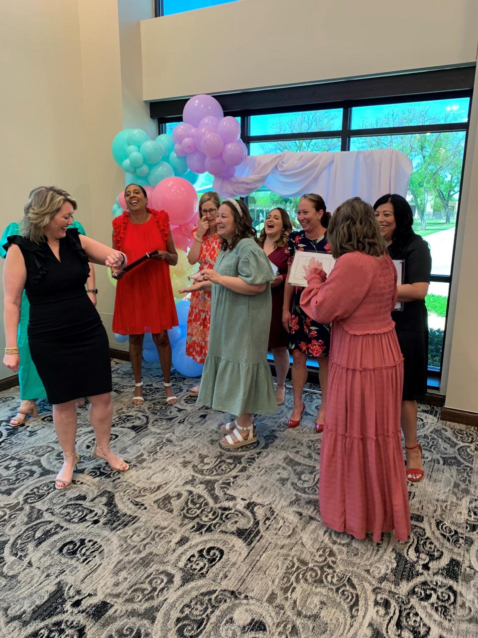 Award winners share a laugh with the volunteers from the Abilene's Women of Outstanding Achievement at the annual award luncheon held on April 22.