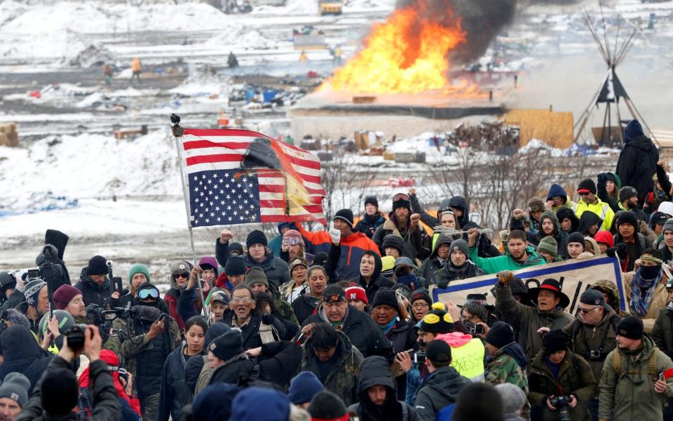 Opponents of the Dakota Access oil pipeline march out of their main camp near Cannon Ball - Terray Sylvester /Reuters