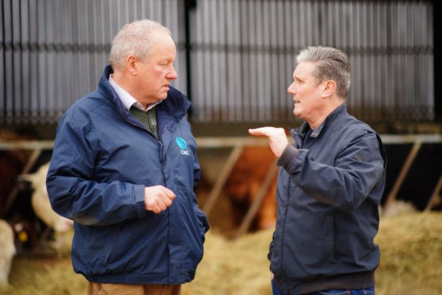 Sir Keir Starmer (right) speaks to Rupert Inkpen, the owner of Home Farm, Solihull, West Midlands 