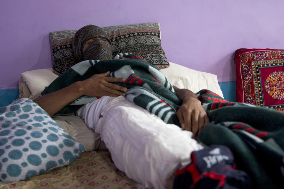 A Kashmiri boy, who was injured in a protest last week, recovers at his home in Srinagar, Indian controlled Kashmir, Saturday, Aug. 17, 2019. Authorities began restoring landline phone services on Saturday after a nearly two-week security crackdown and news blackout following a decision to downgrade the majority-Muslim region's autonomy. (AP Photo/Dar Yasin)