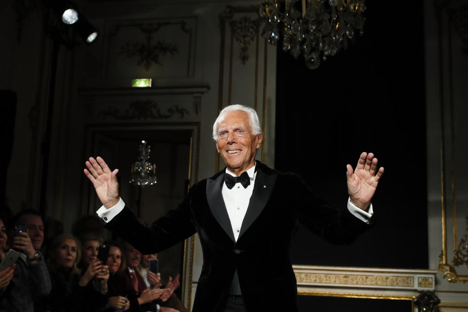 Designer Giorgio Armani accepts applause after his Spring/Summer 2019 Haute Couture fashion collection presented in Paris, Tuesday Jan. 22, 2019. (AP Photo/Francois Mori)