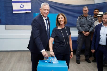 Leader of Blue and White party, Benny Gantz and his wife Revital cast their ballots as they vote in Israel's parliamentary election at a polling station in Rosh Ha'ayin, Israel