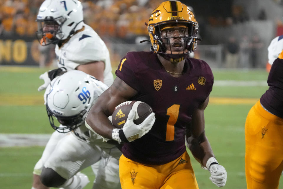 Arizona State running back Xazavian Valladay (1) scores a touchdown against Northern Arizona during the first half during an NCAA college football game Thursday, Sept. 1, 2022, in Tempe, Ariz. (AP Photo/Rick Scuteri)
