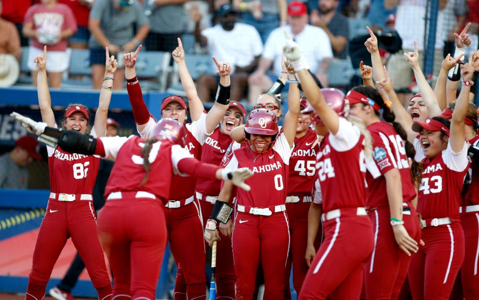 OU celebrates the home run of Grace Lyons (3) in the fifth inning of Game 2 of the WCWS finals on Thursday against Florida State.