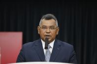 FILE - In this Sept. 13, 2019 file photo, Venezuelan Minister of Internal Affairs, Justice and Peace, Nestor Reverol, gives a press conference in Caracas, Venezuela. On Thursday, March 26, 2020, the U.S. Justice Department made public it has charged in several indictments against Venezuelan President Maduro and his inner circle, including Reverol, that the leader has effectively converted Venezuela into a criminal enterprise at the service of drug traffickers and terrorist groups as he and his allies stole billions from the South American country. (AP Photo/Leonardo Fernandez, File)