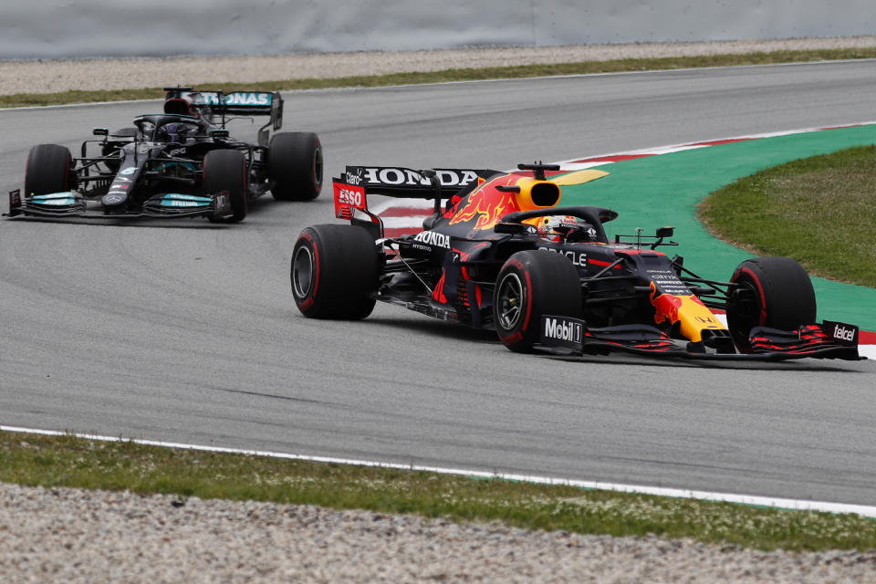 Red Bull driver Max Verstappen of the Netherlands takes a curve followed by Mercedes driver Lewis Hamilton of Britain during the Spanish Formula One Grand Prix at the Barcelona Catalunya racetrack in Montmelo, just outside Barcelona, Spain, Sunday, May 9, 2021. (AP Photo/Joan Monfort)