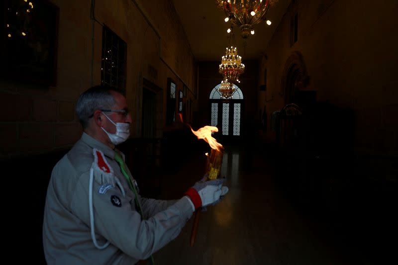 Holy Fire arrives amid coronavirus restrictions, in Ramallah in the Israeli-occupied West Bank