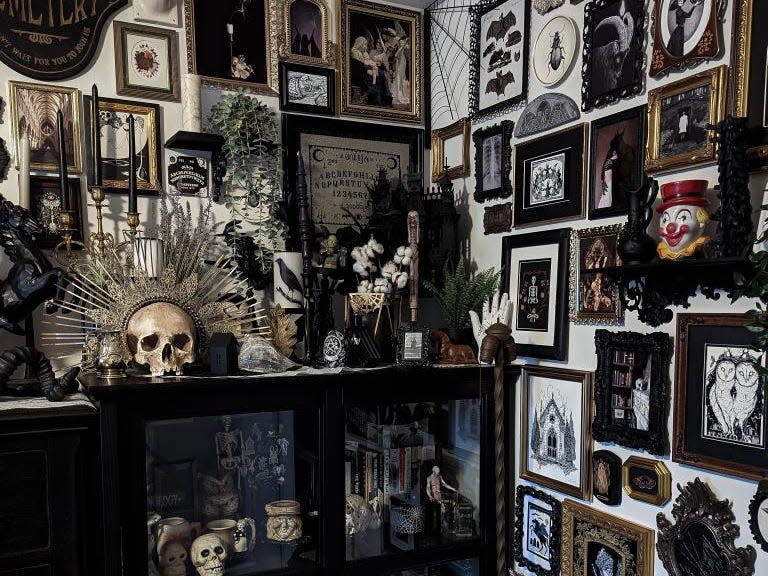 A collection of Gothic interior decor items, including a gallery wall and a curios cabinet.