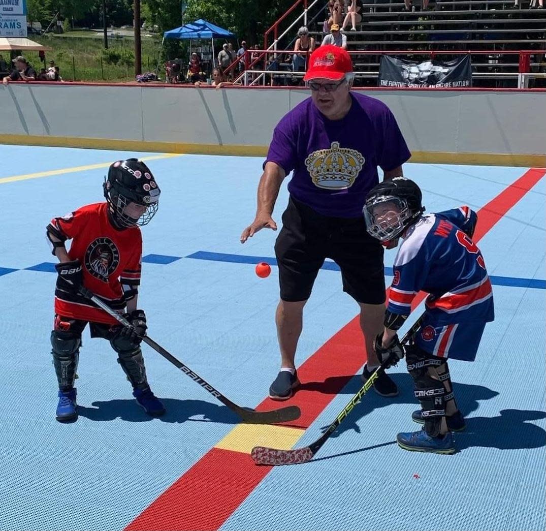 Hockey Hall of Famer Marcel Dionne drops the opening faceoff during a Leominster Dekhockey game during Memorial Day weekend.