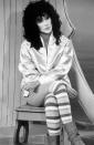 <p>Cher’s perm was legendary - as were these knee-high stripy socks. <i>[Photo: Rex]</i></p>