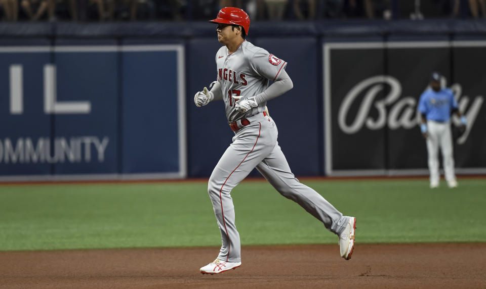 Los Angeles Angels' Shohei Ohtani circles the bases after hitting a solo home run off Tampa Bay Rays opener Andrew Kittredge during the first inning of a baseball game Friday, June 25, 2021, in St. Petersburg, Fla. (AP Photo/Steve Nesius)