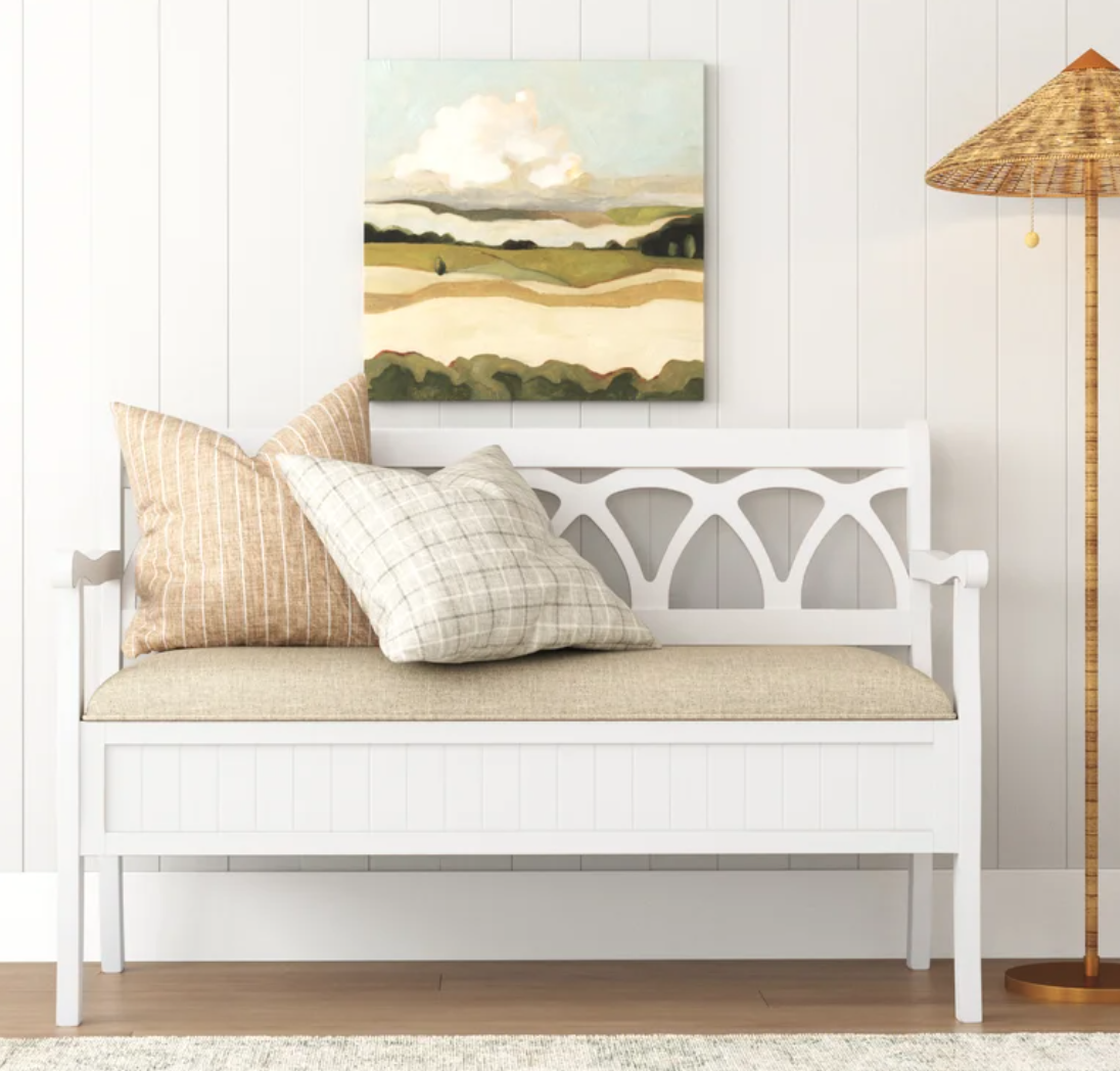 White bench with pillows 