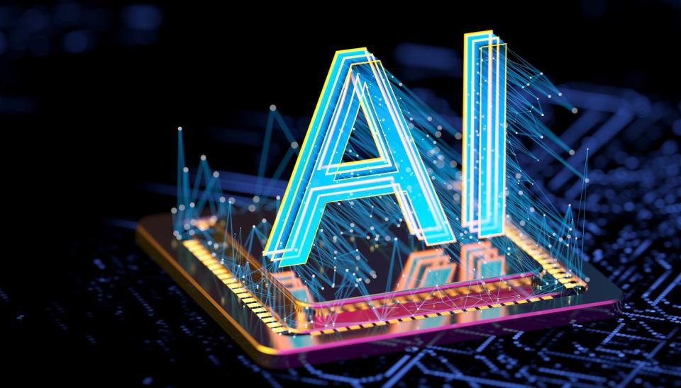 A hologram of the letters AI projected over a computer chip.