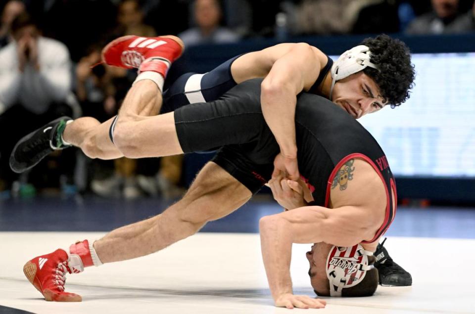 Penn State’s Beau Bartlett controls Indiana’s Danny Fongaro in the 141 lb bout of the match on Sunday, Jan. 14, 2024 at Rec Hall.