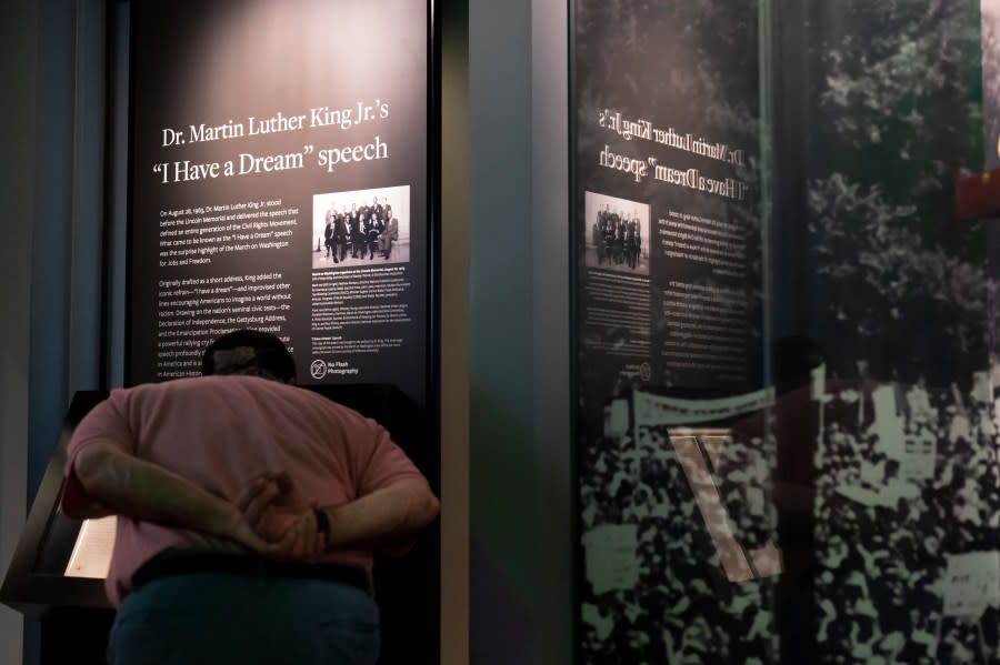 A visitor looks closely at the original copy of the Rev. Martin Luther King Jr.’s “I Have a Dream” speech on display at the National Museum of African American History and Culture in Washington, Friday, Aug. 18, 2023. (AP Photo/Stephanie Scarbrough)