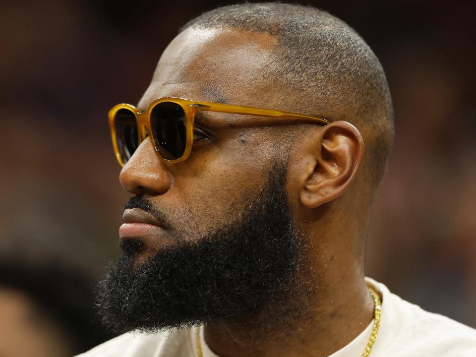 LeBron James wears sunglasses and looks to his right.