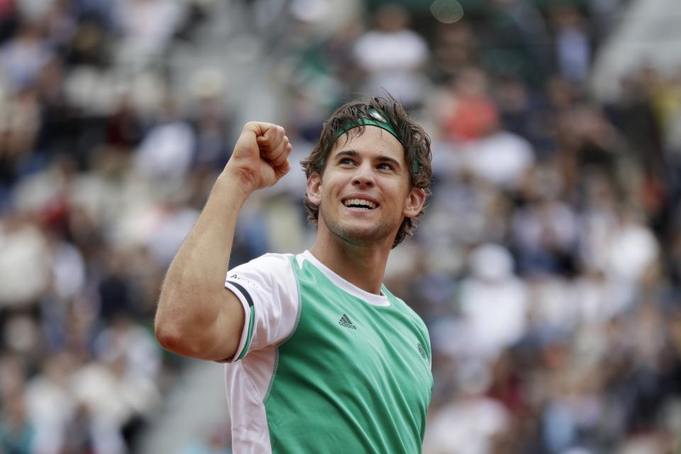 Austria's Dominic Thiem celebrates wining his quarterfinal match of the French Open tennis tournament against Serbia's Novak Djokovic in three sets 7-6 (7-5), 6-3, 6-0, at the Roland Garros stadium