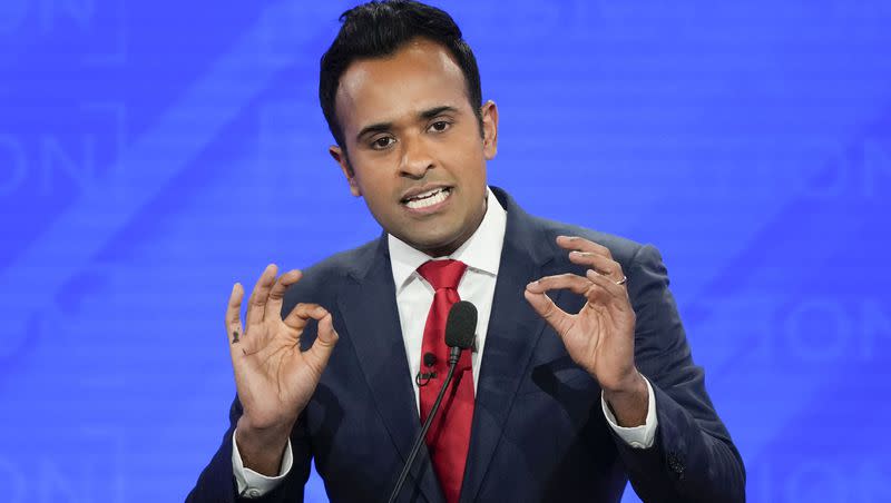 Republican presidential candidate and businessman Vivek Ramaswamy gestures during a Republican presidential primary debate hosted by NewsNation on Dec. 6, 2023, at the Moody Music Hall at the University of Alabama in Tuscaloosa, Ala.