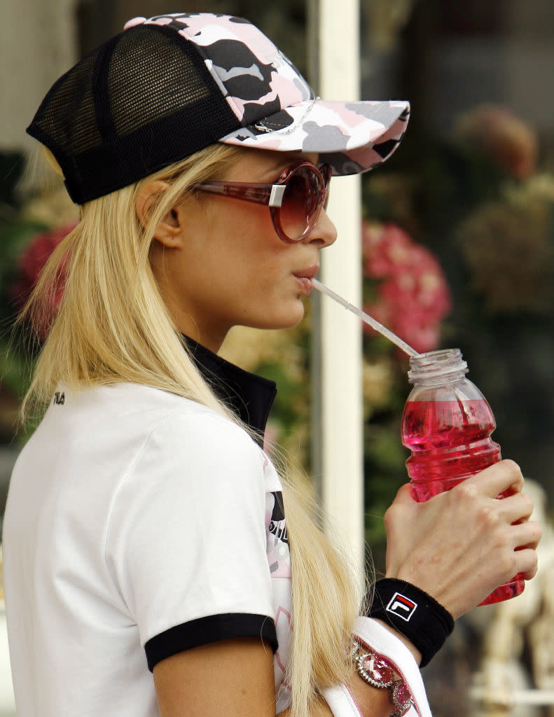 a woman wearing sunglasses and a hat