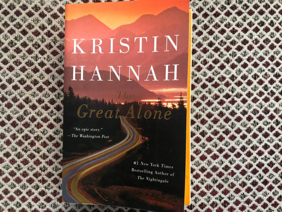 The cover of the book, "Great Alone" by Kristin Hannah.