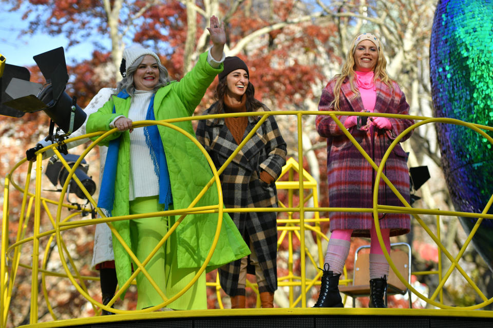 <p>Paula Pell, Sara Bareilles and Busy Philipps of <em>Girls5Eva</em> wave to the crowd during the Macy's Thanksgiving Day Parade. </p>