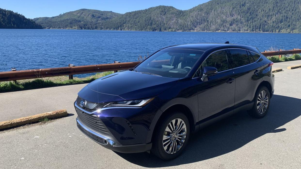 2024 toyota venza parked on a road by a body of water