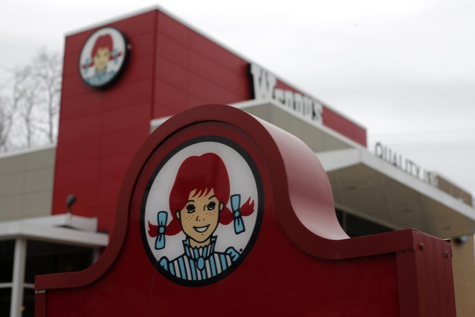 FILE- This March 17, 2014, file photo shows a Wendy's logo outside a Wendy's restaurant in Pittsburgh. Wendy's reports financial results Wednesday, Feb. 21, 2018. (AP Photo/Gene J. Puskar)