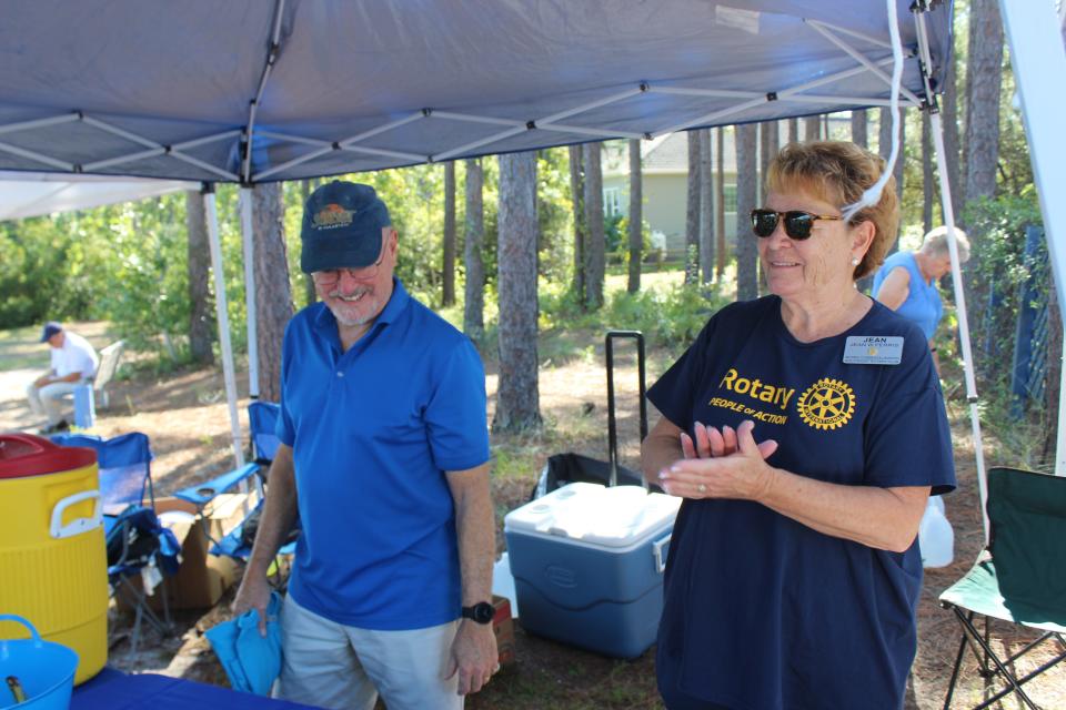 Members of the Southport Rotary Club volunteered to host the Go Jump in the Lake 5K, which is a fundraiser for the New Hope Clinic in Boiling Spring Lakes.