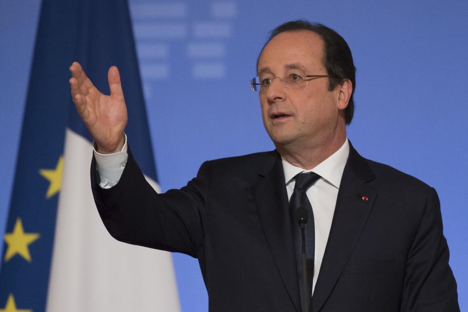 France's President Francois Hollande, gestures as he speaks to the ambassadors during a New Year's speech to he foreign ambassadors to France at the Elysee Palace in Paris, Friday, Jan. 17, 2014. (AP Photo/Michel Euler, Pool)