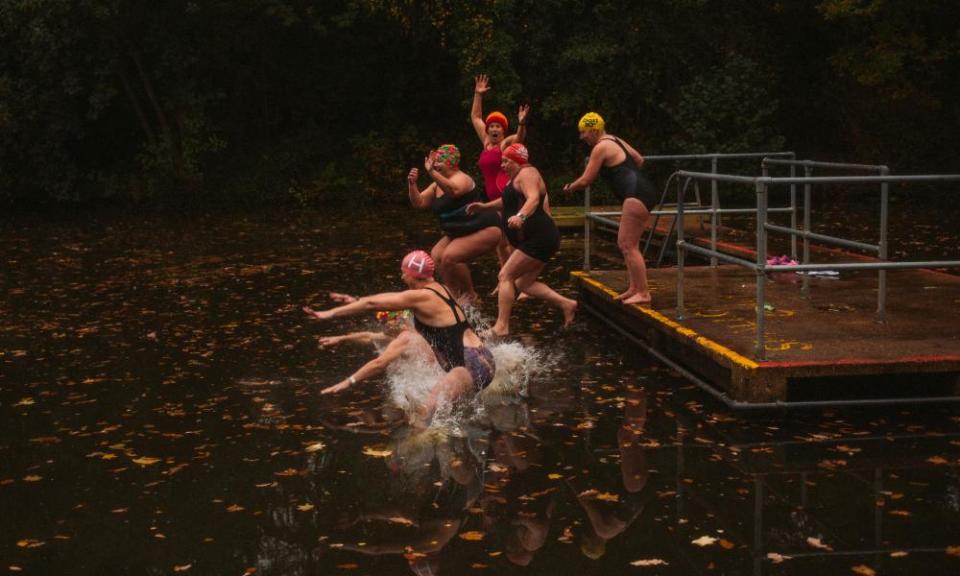 A wild swimming group at Hampstead Heath ponds.