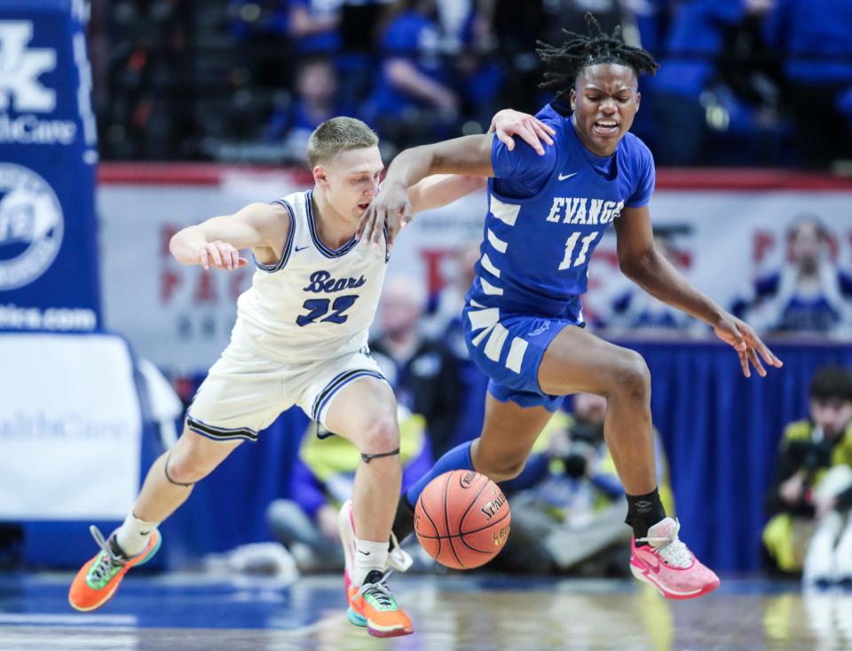 Butler County's Ty Price (22) fouls Evangel Christian's Isaiah Chitapa (11) while trying to steal the ball Thursday of the 2024 UK Healthcare KHSAA Boys' Sweet 16 in Lexington. March 21, 2024