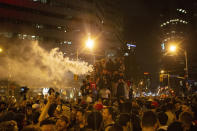 Toronto Raptors fans celebrate atop a vehicle following the Raptors' defeat of the Golden State Warriors in game 6 of the NBA Finals to win the NBA Championship, in Toronto, Friday, June 14, 2019. (Chris Young/The Canadian Press via AP)